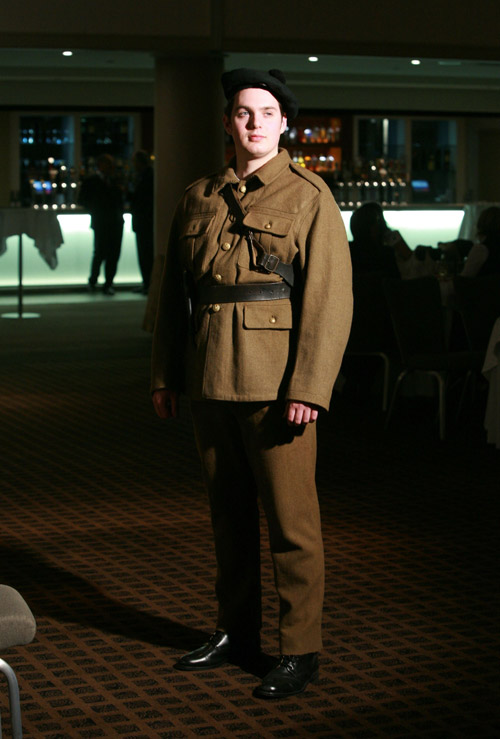 Mike MacCurtin in a Black and Tan uniform
