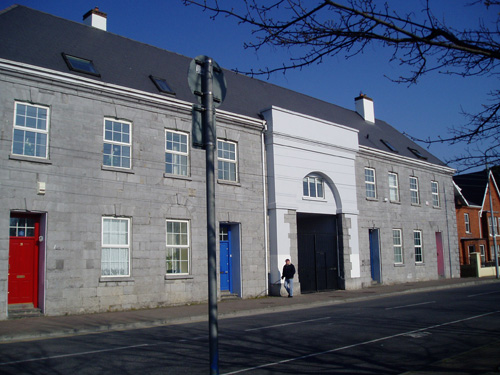 The Strand Barracks as it is today; the red-bricked house on the right, Conakeane, still has the bullet holes from the siege